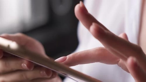 Close Up Of A Woman's Hands Pressing On A Touch Screen Working On A Tablet Standing