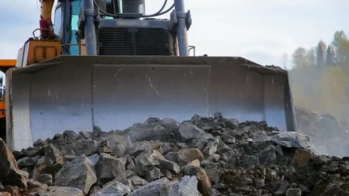 Bulldozer Bewege die Steine und die Erde