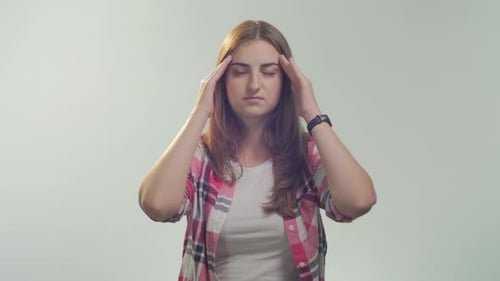 Young woman having head ache