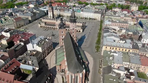 Flying over Main Square, Rynek Glowny in Krakow, Cracow city in Poland, Polska