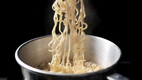 Close Up of Noodles being Cooked in Pot