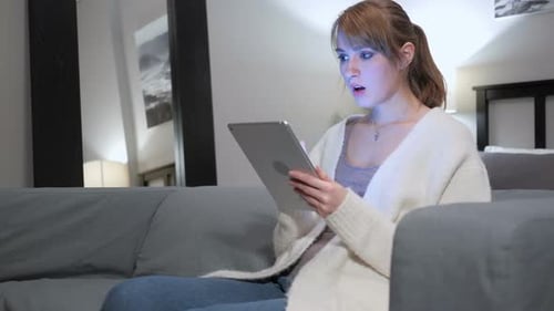 Woman Using Tablet for Video Call at Home