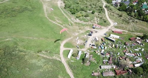 Aerial View of Paragliding in Lush Countryside