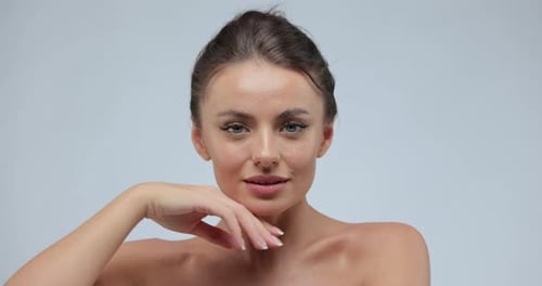 Attractive Woman Posing with Hand Near Face