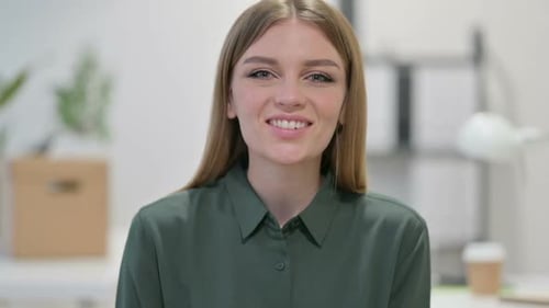 Young Adult Woman Waving and Talking to Camera