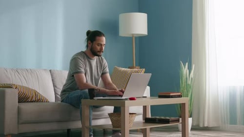 Man working on laptop at home
