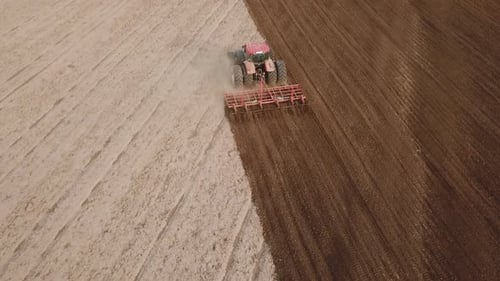 Tractor Plows a Field
