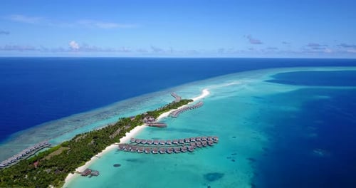 Tropical overhead island view of a white sandy paradise beach and blue water background in colourful