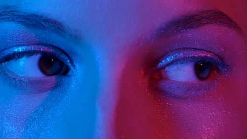 Female Eyes with Shiny Arrows Looking Straight. Close Up Macro Portrait