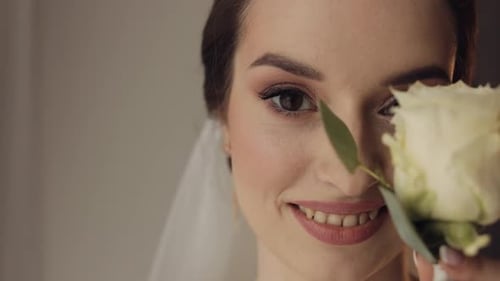 Beautiful Woman Smiling Holding White Rose Flower