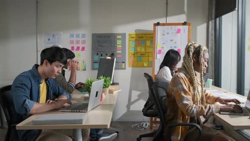 Businessman creative designers present work to the team.Designers a meeting in a modern office.