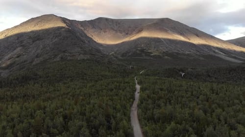 A View From the Top of a Dirt Road Along Forest Leading to the Khibiny Mountains