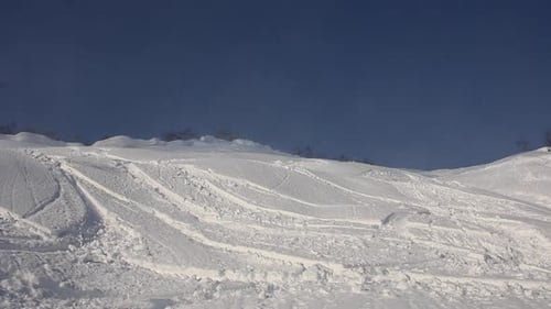 Young man skier skiing in the mountains on fresh powder.