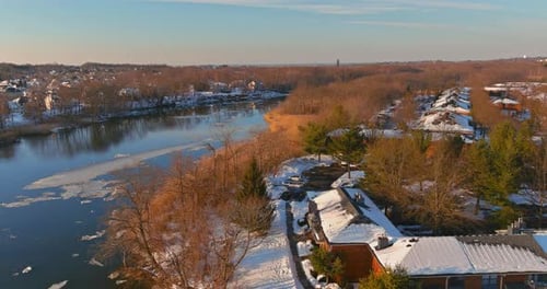 Ice Drift on the River in Early Spring of Ice Float Down the Stream View Apartment Complex From a