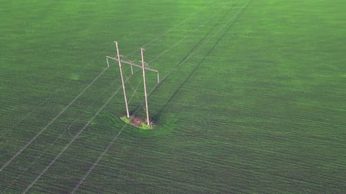 Aerial view above industry utility power lines and pylon structure