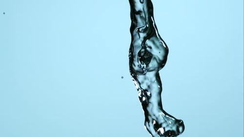 Water Flowing Downwards in a Close Up Shot