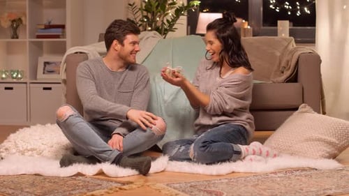 Couple Celebrating at Home with a Special Gift