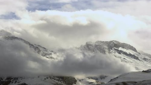 Snowy Mountains and Clouds