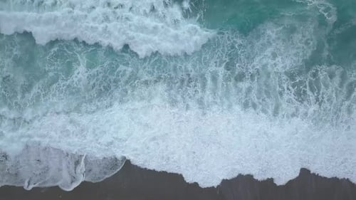 Top View Sea Waves Break on Empty Beach. Clean Sea From Bird's Eye View, Ocean Waves Reaching Shore