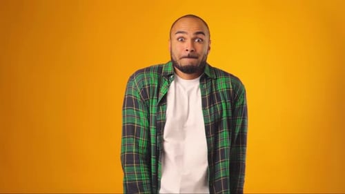 Man Surprised on Yellow Background