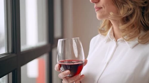 Female Drinking Wine Indoors