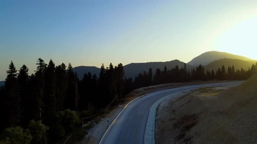 steep green mountains, deep forest and mountain road, beautiful valley in the morning