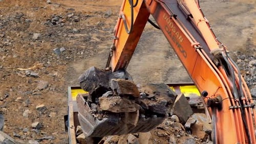 Excavator working in quarry. Heavy excavator working at the construction site