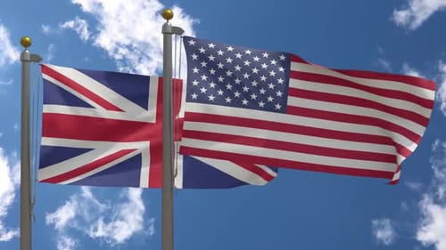 American and British Flags Waving in Blue Sky