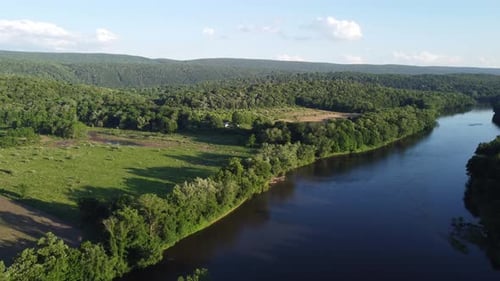 aerial view overlooking river and trees