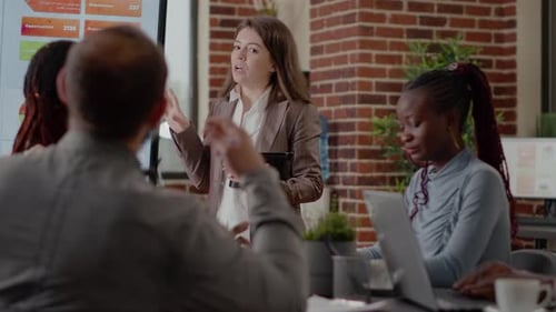Close Up of Woman Doing Business Presentation in Boardroom