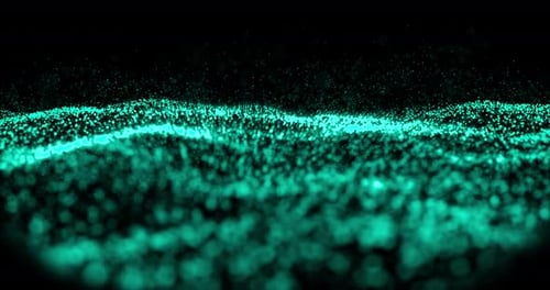 Waves of green particles moving against black background