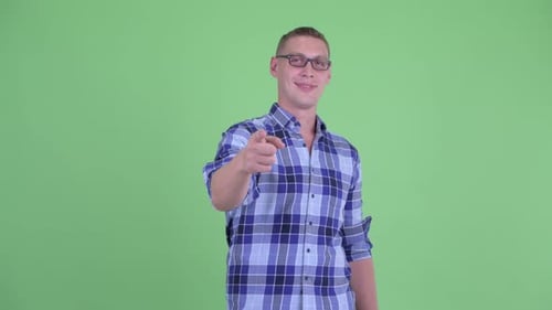 Happy Young Hipster Man Pointing at Camera