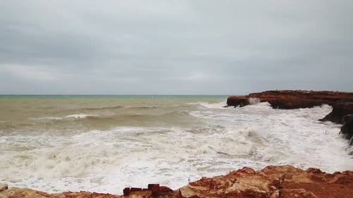 Ocean Very Big Wave Foam Sea Spray. Powerful Waves Washing Over Dangerous Rocky Coastline Slow