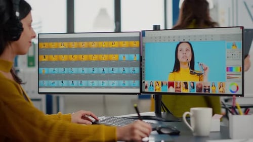 Woman Video Editor Working at Computer in Office