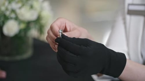 Shop Assistant Showing Silver Emerald Ring