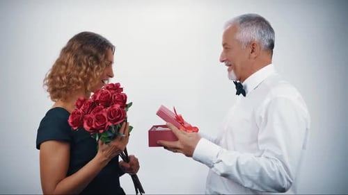 Romantic Couple with Flowers and Gift Box