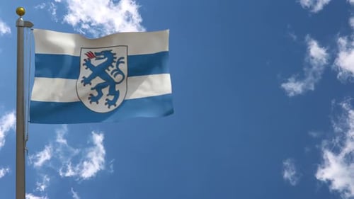 Realistic Waving Flag with Blue Lion Heraldry Crest against Blue Sky
