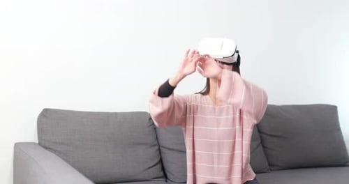 Woman With VR Headset Interacts With Hand Gestures
