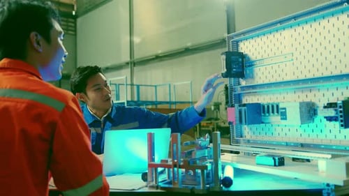 Engineers Working at a Technological Manufacturing Factory