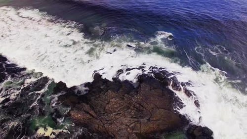 Aerial view of waves reaching a shore at beach