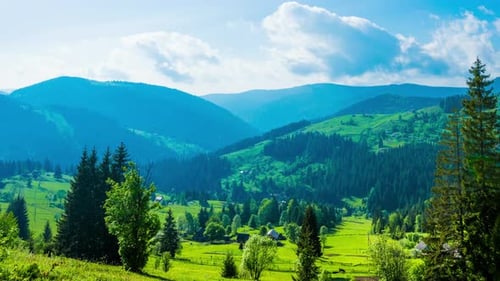 Time Lapse of Blue Sky with Clouds Over Mountain