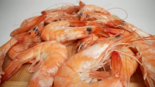 Pile of Cooked Orange Shrimp on a Board