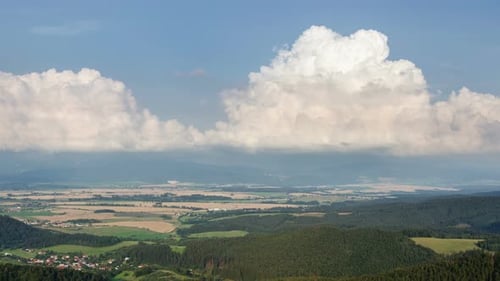 Clouds Towering over Rural Landscape and Fields in Summer Day