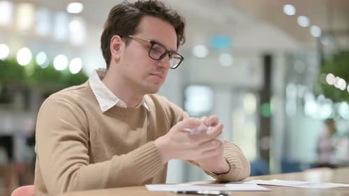 Young Adult Writes, Crumples Paper in Frustration