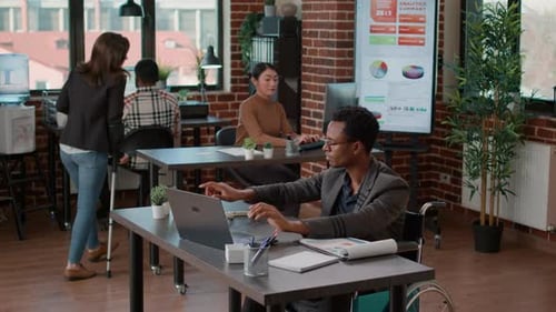 Employees Working in Modern and Accessible Office