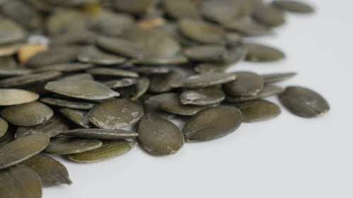 Shelled pumpkin seed close-up 4K footage