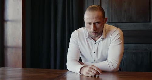 Pensive Frustrated Executive Man Contemplating Problem in Modern Office