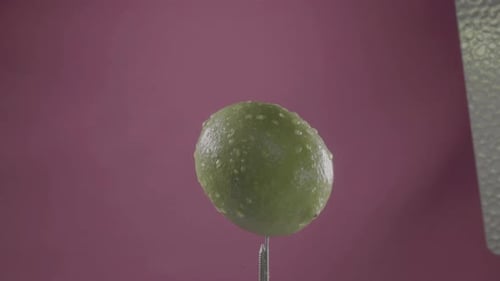 Lemon Rotating with Loop on Fuchsia Screen for Chroma Key