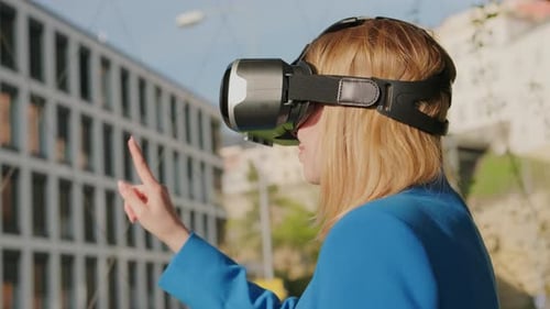 Woman Using VR Headset in City