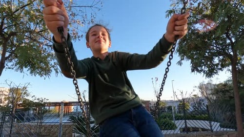Teenage Boy on a Swing